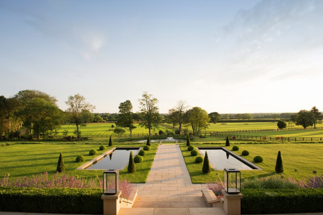topiary pond lawn flowing colourful welch landscape design
